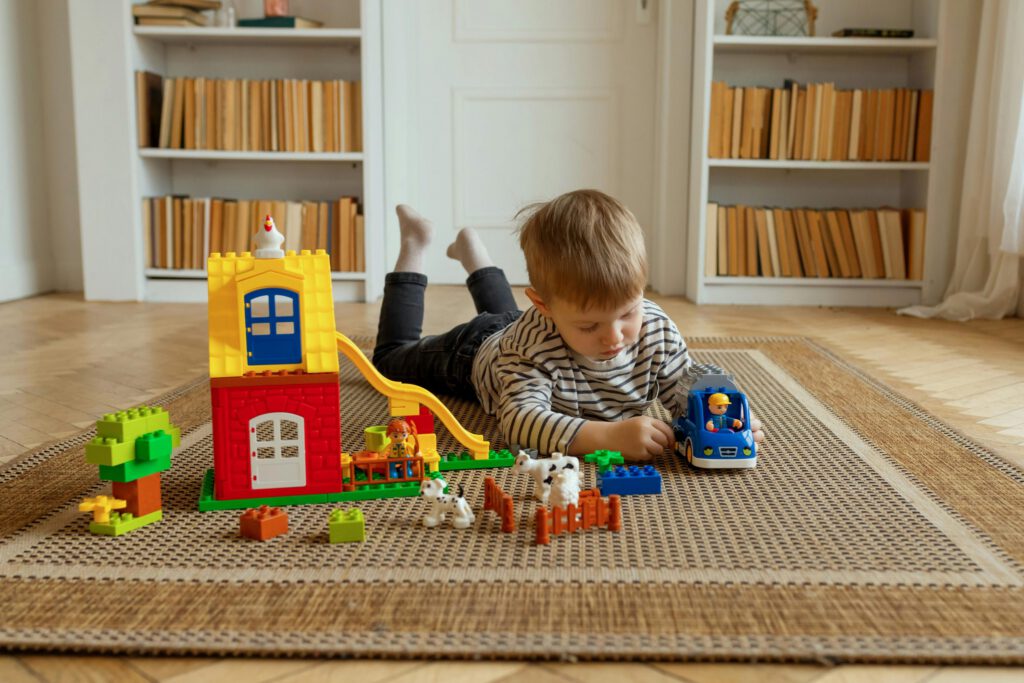 child-playing-lego-on-floor