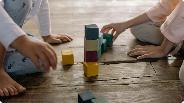 Two children playing with blocks
