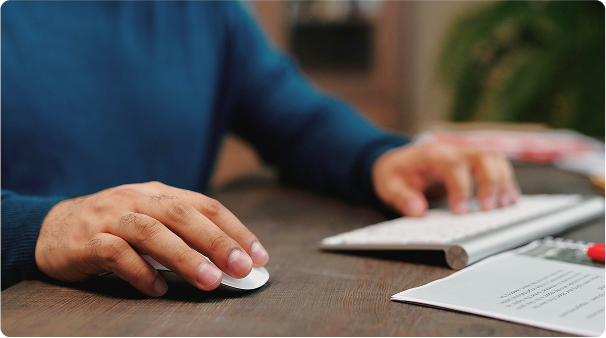 A person using a mouse and keyboard